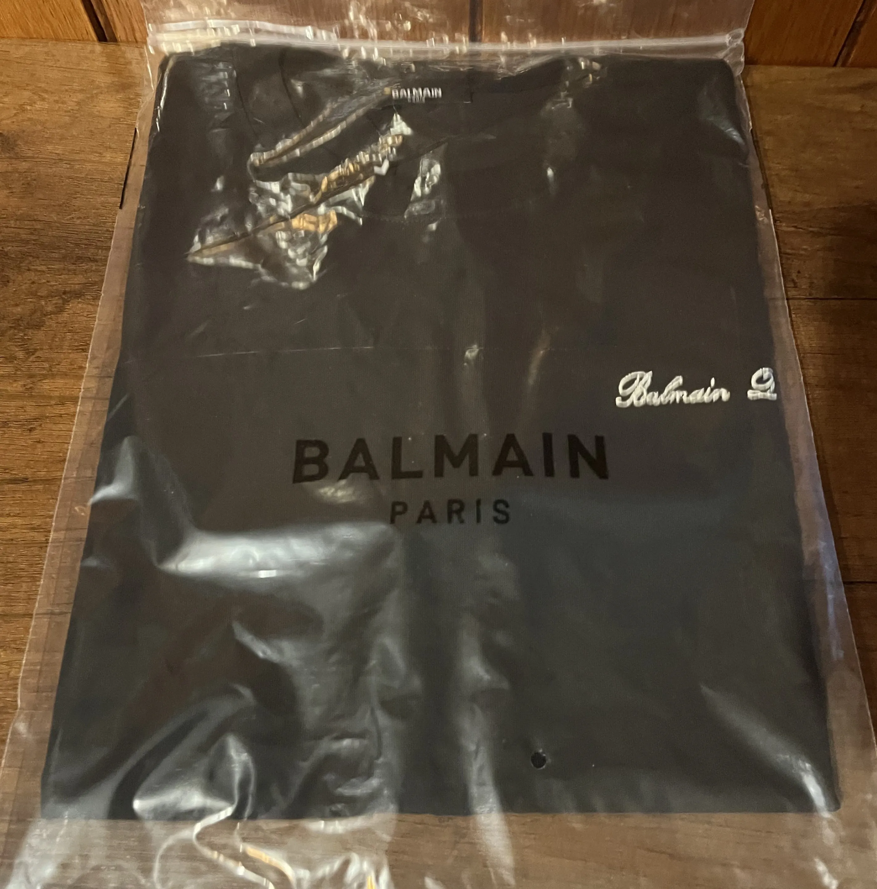 Balmain "Signature Logo Embroidered" T-Shirt styled in Black for Spring/Summer 2024