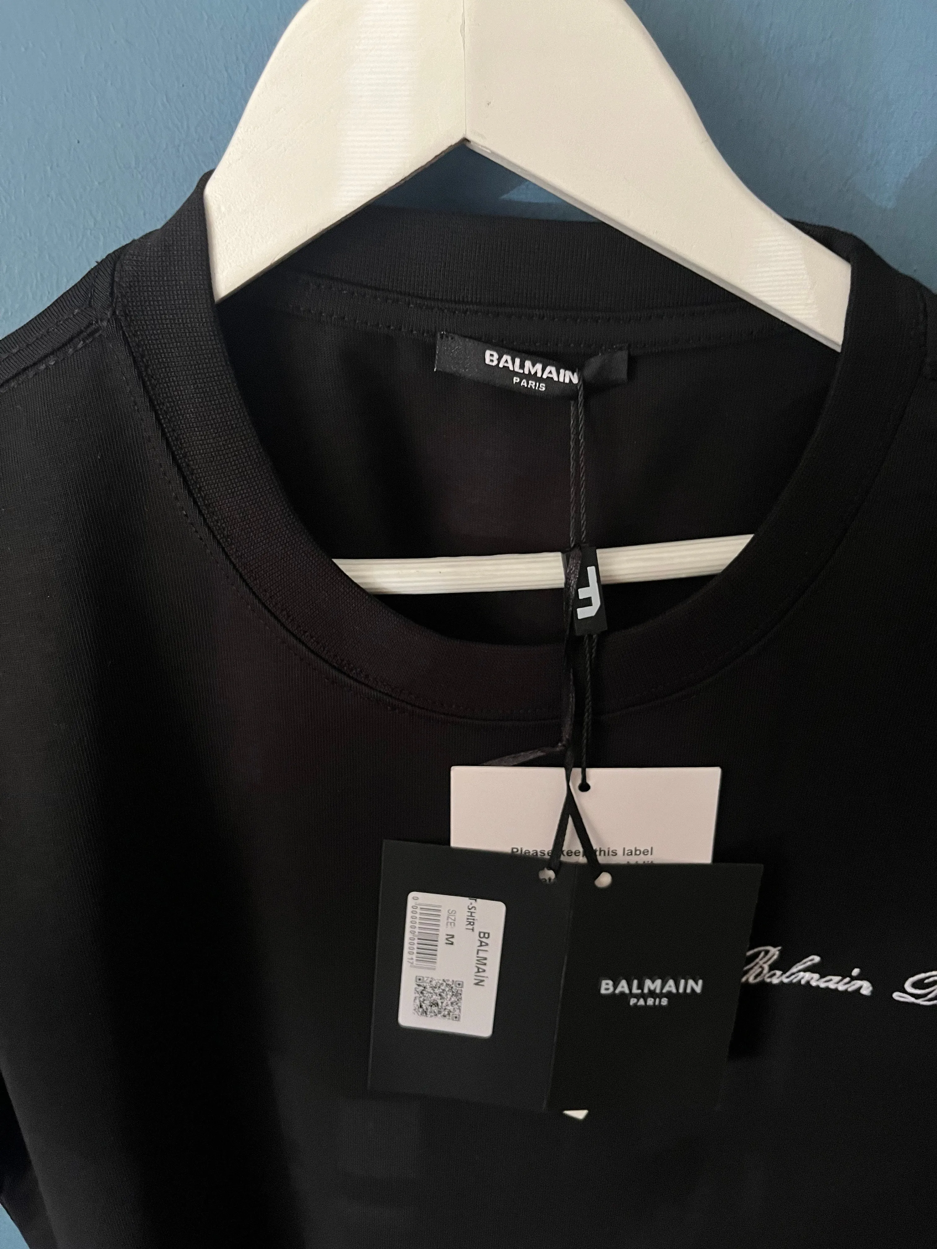 Balmain "Signature Logo Embroidered" T-Shirt styled in Black for Spring/Summer 2024