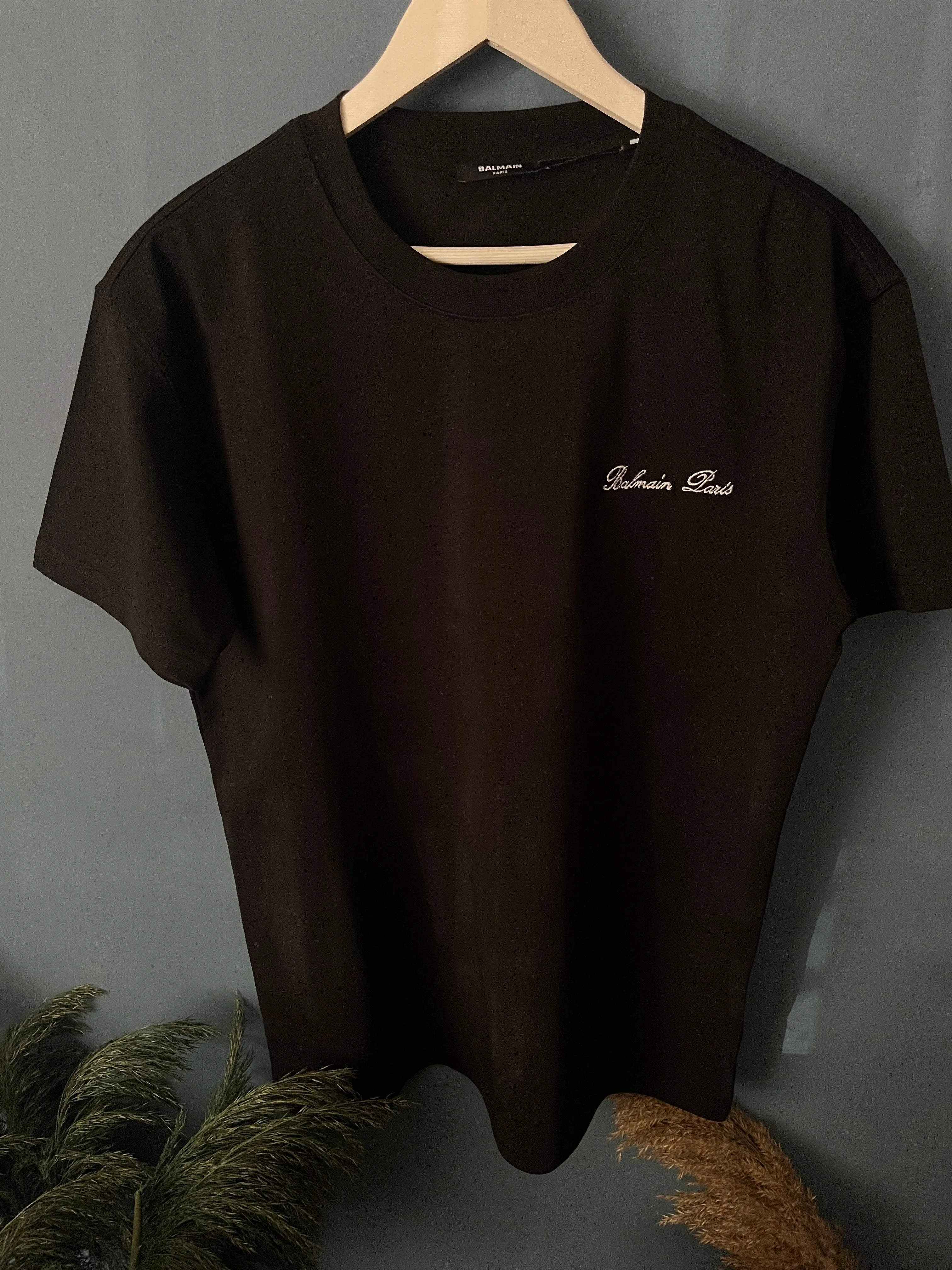 Balmain "Signature Logo Embroidered" T-Shirt styled in Black for Spring/Summer 2024