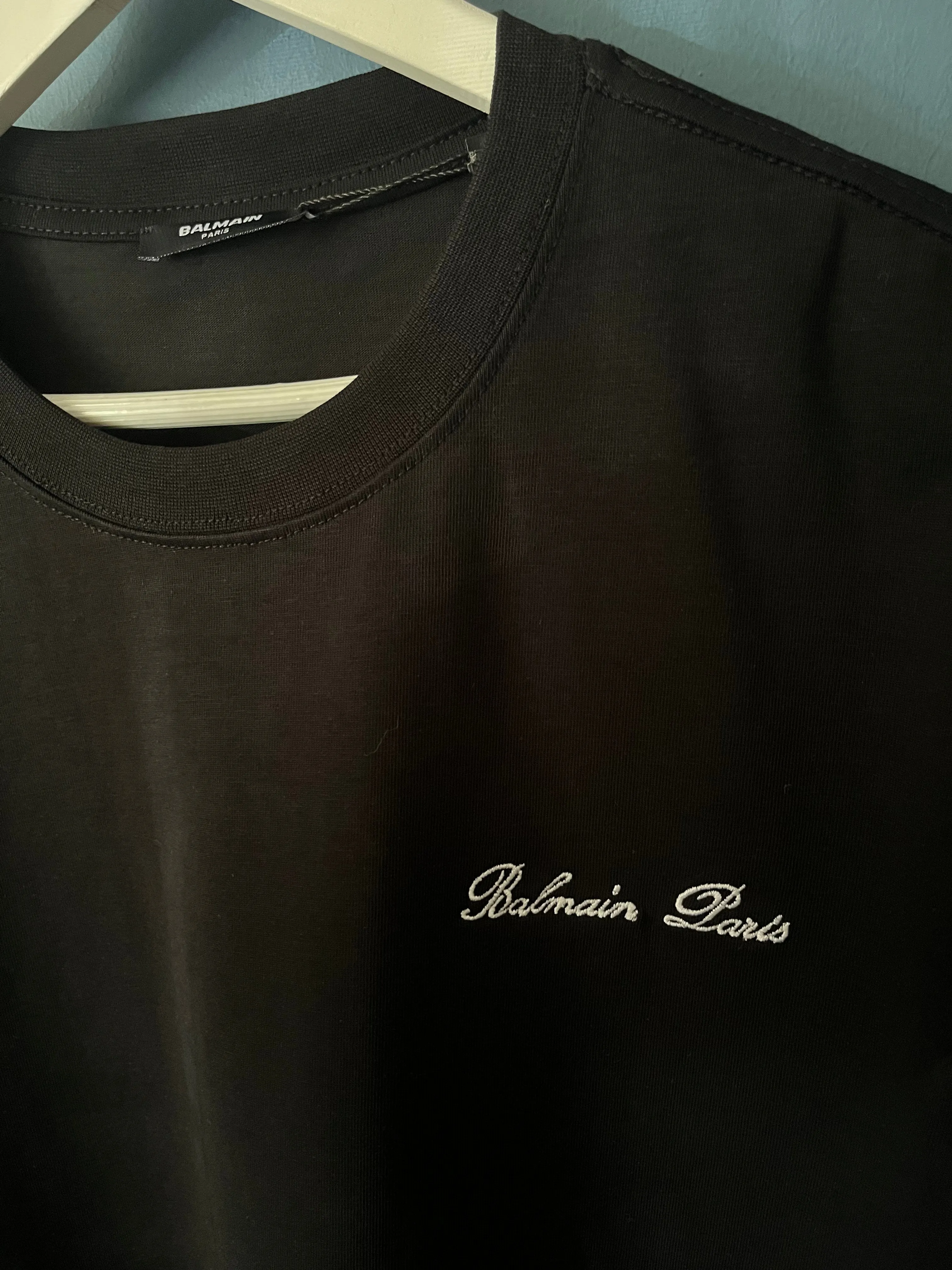 Balmain "Signature Logo Embroidered" T-Shirt styled in Black for Spring/Summer 2024