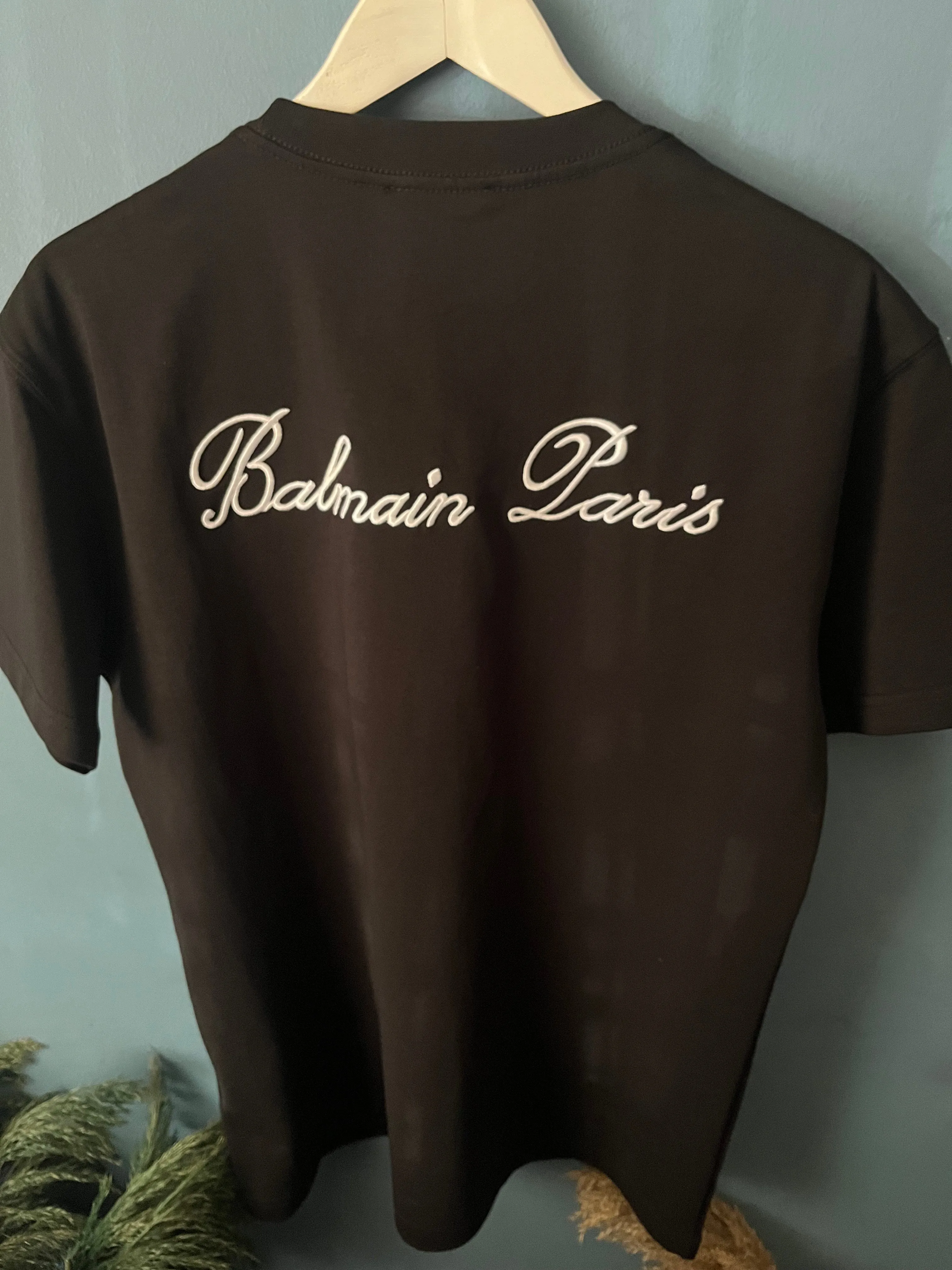 Balmain "Signature Logo Embroidered" T-Shirt styled in Black for Spring/Summer 2024