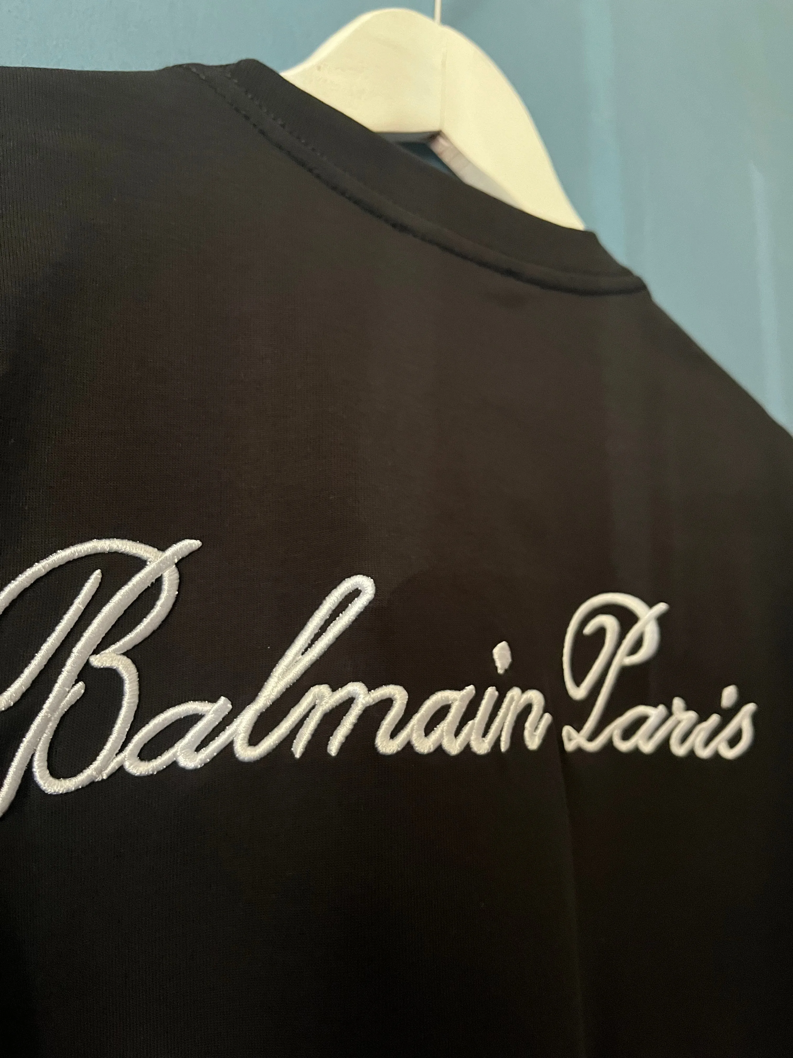 Balmain "Signature Logo Embroidered" T-Shirt styled in Black for Spring/Summer 2024